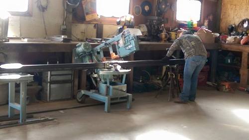 Using hand saw in Fusion Fabrications shop, 6545 E. County Rd. #14, Loveland Colorado